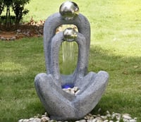 Meditating Couple with 2 Stainless Steel Spheres Water Feature