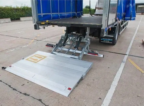 Delivery truck with its tail lift fully lowered to the ground